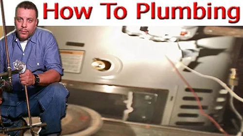 Hand pressing the reset button on an electric water heater panel