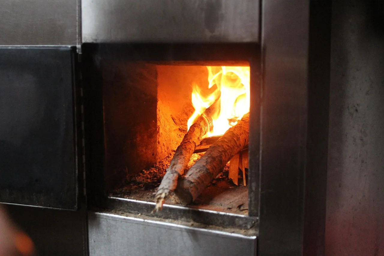 Homeowner compares heater warmth in a living room while checking room temperature