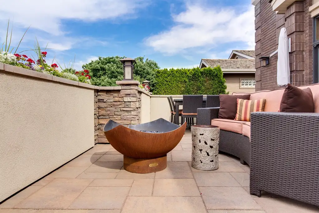 Homeowner compares an outdoor patio heater and an indoor space heater in separate spaces.