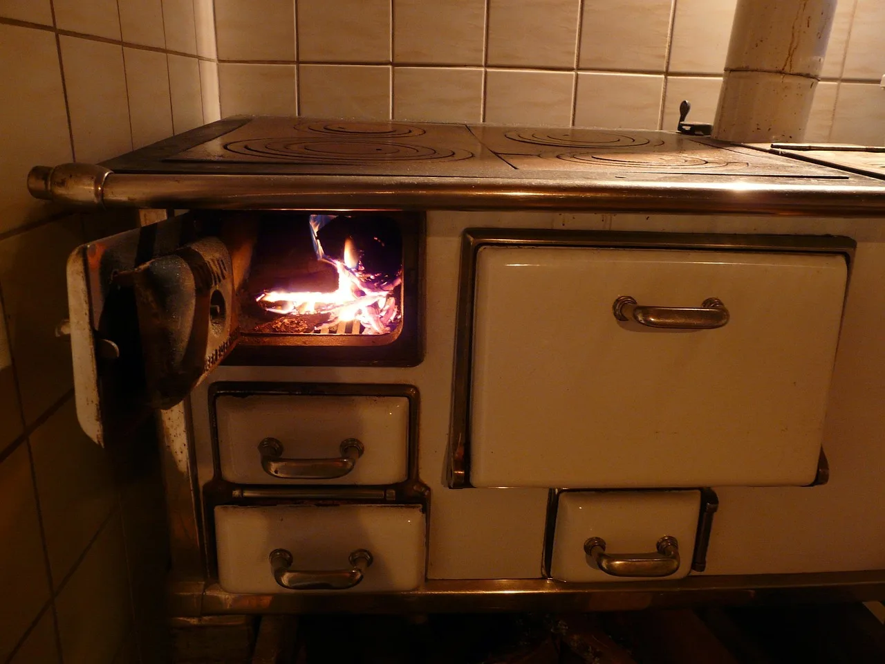 Wood stove heating a living room with an open hallway showing possible heat flow